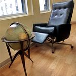 A globe and his office recliner 